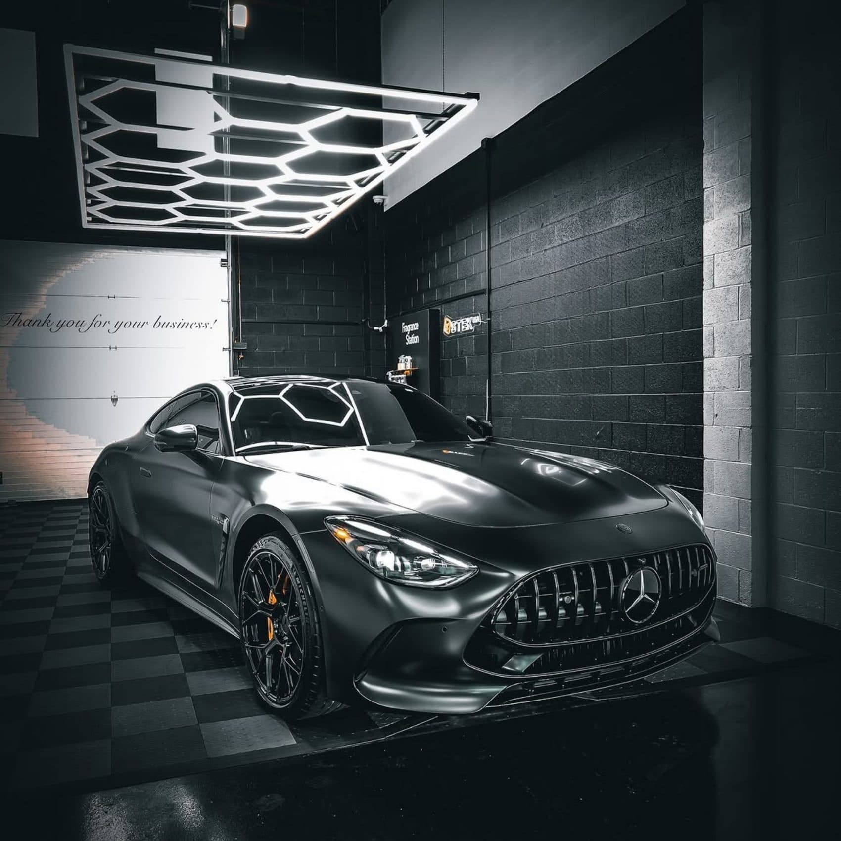 Black Mercedes AMG GT after detailing, photographed in a studio
