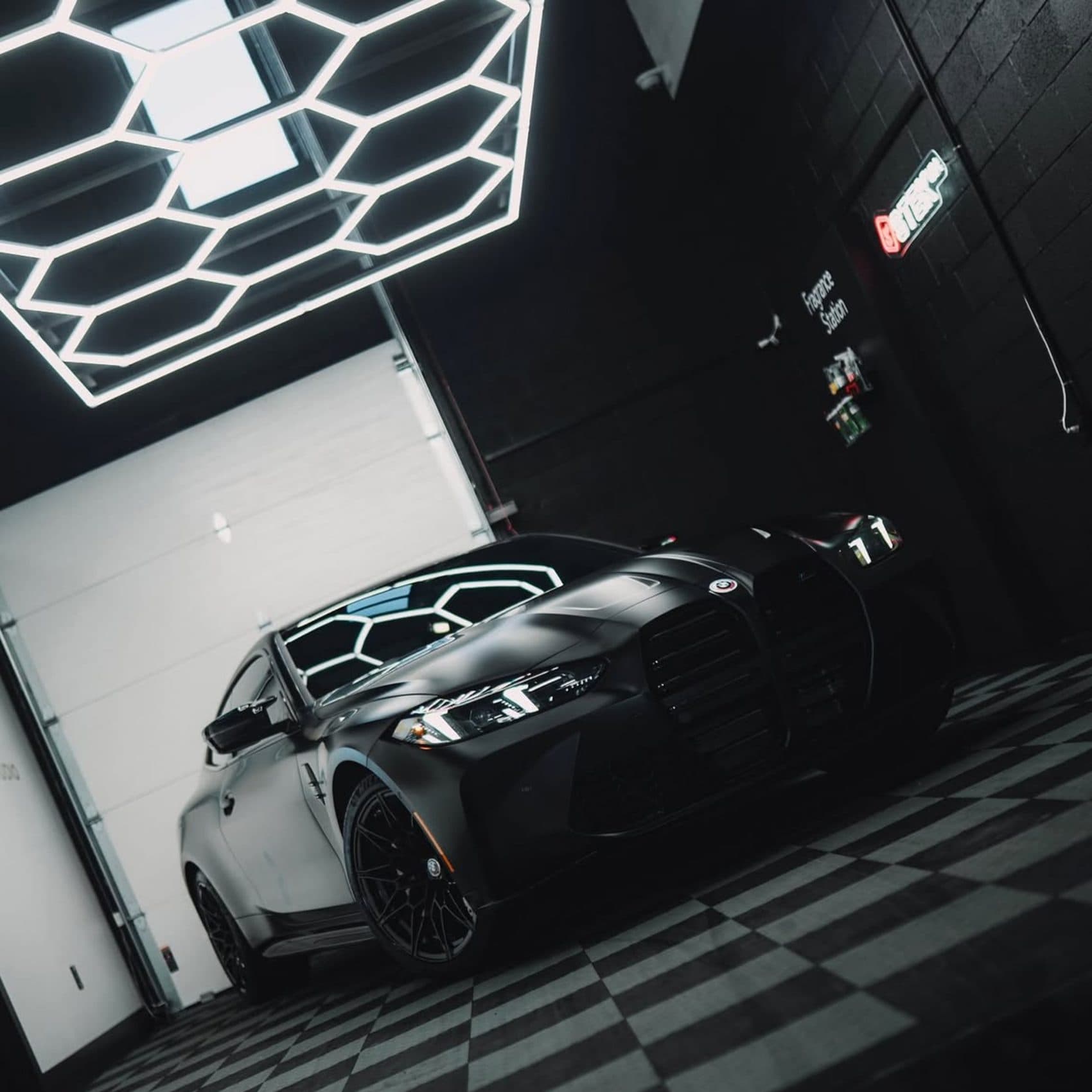 Black BMW finished and photographed under detailing studio lighting